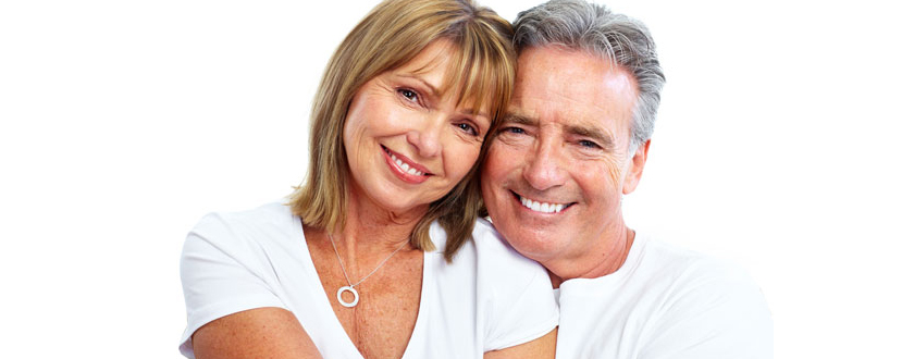 happy elderly couple with dentures